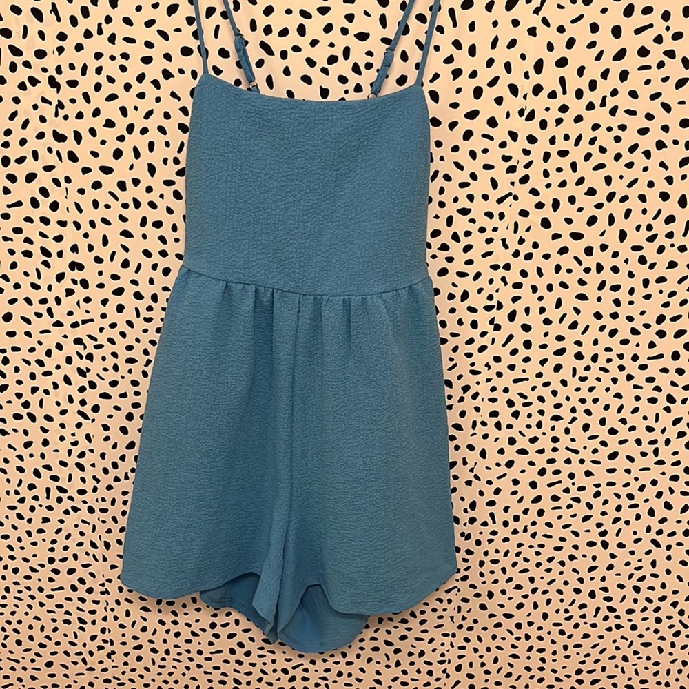 BLUE FLOWY ROMPER WITH BOW IN BACK *** NEVER WORN
